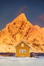 Lofoten islands beautiful nature landscape in Norway and fishing town with scenic yellow rorbu house of Sakrisoy, Reine Royalty Free Stock Photo