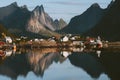 Lofoten islands in Norway landscape mountains reflection in a water fjord Reine village Royalty Free Stock Photo