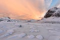 Lofoten Islands in Norway and their beautiful winter scenery at sunset. Idyllic landscape with snow covered beach. Tourist attract