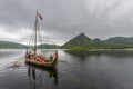 Departure of the Reconstructed Viking boat with tourists, in Innerpollen salty lake in Vestvagoy island of Lofoten archipelago.