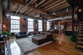 A loft apartment, open space with few interior walls, hight cellings exposed brick and concerete, large windows Royalty Free Stock Photo