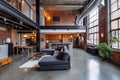 A loft apartment, open space with few interior walls, hight cellings exposed brick and concerete, large windows Royalty Free Stock Photo