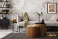 Loft and indiustral interior design of living room interior with mock up poster frame, leather brown armchair, gray sofa, green Royalty Free Stock Photo