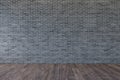 Loft interior with blank gray brick wall and wooden floor.