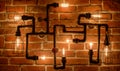 Loft lamp with Edison lamps on a brick wall background