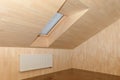 Room sheathed in light wood planks