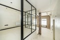 Loft studio with room with metal and glass enclosure with many corners