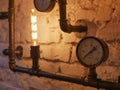 Loft style decor With iron pipes. and incandescent lamps. Loft style wall and steampunk pipes Royalty Free Stock Photo