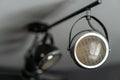 Loft style iron chandelier on the ceiling, with a old motorcycle headlight in the interior living room in modern Royalty Free Stock Photo