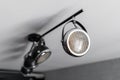 Loft style iron chandelier on the ceiling, with a old motorcycle headlight in the interior living room in modern Royalty Free Stock Photo