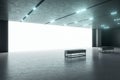 Loft style modern exhibition hall with concrete floor and ceiling, big white blank wall as a projection screen and benches. Mockup Royalty Free Stock Photo