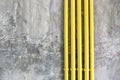 Loft style wall texture background with yellow pipe