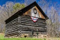 Log Barn with an American Banner Royalty Free Stock Photo