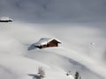 Log Cabin in deep snow in South Tyrol Alps