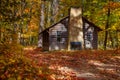 Log Cabin in Fall Woods