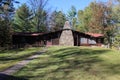 A Log Cabin with a Field Stone Fireplace Royalty Free Stock Photo