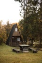 Log cabin in the forest. Wooden house in mountains. Royalty Free Stock Photo