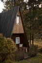 Log cabin in the forest. Wooden house in mountains. Royalty Free Stock Photo