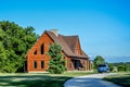 Log Cabin Home with Blue Vehicle Royalty Free Stock Photo