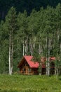 Log cabin home in mountain forest Royalty Free Stock Photo