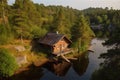 log cabin with lake view, surrounded by nature