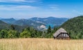 Log cabin on landscape