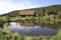 Log cabin by pond