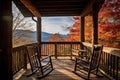 log cabin porch with rocking chairs and a scenic view Royalty Free Stock Photo