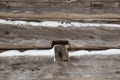 Log cabin sawn logs closeup with snow in between Royalty Free Stock Photo