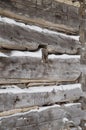 Log cabin sawn logs to corner closeup with snow in between Royalty Free Stock Photo