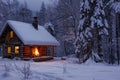 A log cabin surrounded by snow with a fireplace burning inside, creating a warm and cozy atmosphere, A cozy cabin covered in snow Royalty Free Stock Photo
