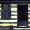 Log Cabin Texture with Door and Window Royalty Free Stock Photo