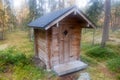 Log Cabin Toilette in Deep Taiga Forest