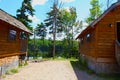 Log cabins in the woods by a lake