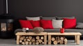 Log coffee table sits next to a rustic sofa with red and gray cushions against a dark plaster background. Royalty Free Stock Photo