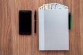 The daily log with denomination dollars on a wooden table. Royalty Free Stock Photo