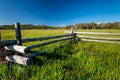 Log fence with Sawtooth mountains of Idaho and wild flowers