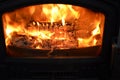Log Fire In A Black Fireplace