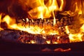 Log Fire In A Black Fireplace