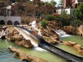 Log flume ride, blurred boat in slope in Mexican themed setting