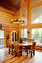 A rustic log home dining room. Royalty Free Stock Photo