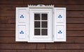 Log house with decorated window Royalty Free Stock Photo