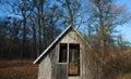 Log house. Old single house. Photo of an unusual house in the forest. Abandoned single small house in foreste