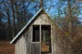 Log house. Old single house. Photo of an unusual house in the forest. Abandoned single small house in foreste