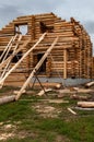 a log house under construction with a device for lifting logs Royalty Free Stock Photo
