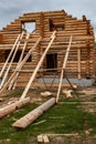 a log house under construction with a device for lifting logs Royalty Free Stock Photo