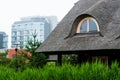 Log houses with a reed roof closeup Royalty Free Stock Photo