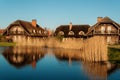 Log houses with a reed roof Royalty Free Stock Photo