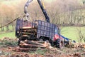 Log loader machine felled in a Galician forest. Royalty Free Stock Photo