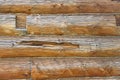 Log masonry from thick old cracked logs, wood structure, cracks and knots, wooden background